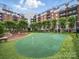 Beautiful putting green in a well-manicured lawn area in a luxury apartment complex at 300 W 5Th St # 339, Charlotte, NC 28202