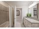 Bright bathroom features tile floors, a shower and a vanity with a stone countertop at 3032 Kings Manor Dr, Matthews, NC 28104