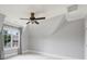 Bedroom with neutral walls, a ceiling fan, window and an architectural angled ceiling at 3032 Kings Manor Dr, Matthews, NC 28104