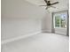 Bedroom with neutral walls, a ceiling fan, window and an architectural angled ceiling at 3032 Kings Manor Dr, Matthews, NC 28104