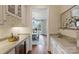 Butler's pantry with granite countertops and custom cabinetry leading to the dining room at 3032 Kings Manor Dr, Matthews, NC 28104