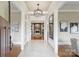 Inviting foyer boasting marble floors, elegant lighting, and views of the living room at 3032 Kings Manor Dr, Matthews, NC 28104