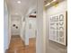 Bright hallway with hardwood floors and modern art at 3032 Kings Manor Dr, Matthews, NC 28104