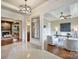 Hallway leading into an office area; hardwood flooring with abundant natural light at 3032 Kings Manor Dr, Matthews, NC 28104