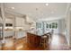 Spacious kitchen showcasing a large island, stainless steel appliances, and breakfast nook at 3032 Kings Manor Dr, Matthews, NC 28104
