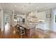 Spacious kitchen with a large central island, stainless steel appliances, and hardwood floors at 3032 Kings Manor Dr, Matthews, NC 28104