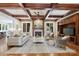 Elegant living room features coffered ceilings, fireplace, and neutral decor, creating a warm ambiance at 3032 Kings Manor Dr, Matthews, NC 28104