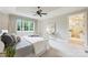 This main bedroom features a tray ceiling, a window seat, and an ensuite bathroom at 3032 Kings Manor Dr, Matthews, NC 28104