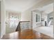 Upstairs landing area that can be used as a bonus room with hardwood floors and lots of natural light at 3032 Kings Manor Dr, Matthews, NC 28104