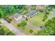 Expansive aerial view of a charming home with a large yard, featuring mature trees and ample parking at 309 Ogden Dr, Gastonia, NC 28056