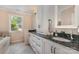 Elegant bathroom features a dual-sink vanity with marble countertops, and bright lighting at 309 Ogden Dr, Gastonia, NC 28056