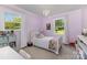 Bright bedroom with lilac walls and chandelier at 309 Ogden Dr, Gastonia, NC 28056