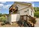 Back exterior featuring wooden steps leading to a balcony, with convenient bike parking at 309 Ogden Dr, Gastonia, NC 28056