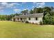 Charming one-story home with brick exterior, lush lawn, and a separate garage at 309 Ogden Dr, Gastonia, NC 28056