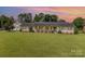 Charming one-story home with brick exterior, lush lawn, and a separate garage at 309 Ogden Dr, Gastonia, NC 28056