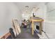 Spacious garage converted to a music room or studio space with a drum set and work table at 309 Ogden Dr, Gastonia, NC 28056