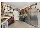 Functional garage with workbench, tool storage, and a refrigerator, perfect for projects and storage at 309 Ogden Dr, Gastonia, NC 28056