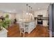 Open-concept kitchen with a center island and stainless steel appliances at 309 Ogden Dr, Gastonia, NC 28056