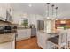 Open-concept kitchen with stainless steel appliances and center island at 309 Ogden Dr, Gastonia, NC 28056