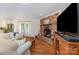 Inviting living room with exposed brick fireplace and hardwood floors at 309 Ogden Dr, Gastonia, NC 28056