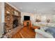 Inviting living room with exposed brick fireplace and hardwood floors at 309 Ogden Dr, Gastonia, NC 28056
