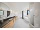 Modern bathroom with double vanities, soaking tub, and walk-in shower, designed for relaxation and comfort at 309 Sain Rd, Statesville, NC 28625