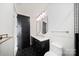 Modern bathroom with black hexagon tile, matte black door, and double vanity at 309 Sain Rd, Statesville, NC 28625