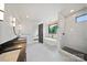 Modern bathroom featuring soaking tub, glass shower, and contemporary vanity with black countertop and sleek fixtures at 309 Sain Rd, Statesville, NC 28625