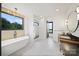 Bright bathroom with freestanding tub, walk-in shower, and sleek vanity offering a modern and luxurious feel at 309 Sain Rd, Statesville, NC 28625
