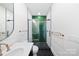 Bright modern bathroom with walk-in shower and hexagon tile at 309 Sain Rd, Statesville, NC 28625