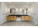 Bright bathroom features a double vanity with striking round mirrors and modern lighting at 309 Sain Rd, Statesville, NC 28625