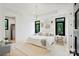 Bright bedroom with large windows, stylish decor, and a comfortable seating area at 309 Sain Rd, Statesville, NC 28625