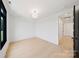 Bright bedroom featuring hardwood floors, lots of natural light, and neutral decor creating a serene atmosphere at 309 Sain Rd, Statesville, NC 28625