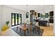 Chic dining area with modern table, stylish chairs, and views to the backyard at 309 Sain Rd, Statesville, NC 28625