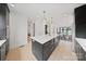 Spacious kitchen with an island, plenty of storage, and an open layout connecting to the dining room at 309 Sain Rd, Statesville, NC 28625