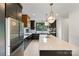 Modern kitchen with stainless steel appliances, black cabinets, and a large island with a quartz countertop at 309 Sain Rd, Statesville, NC 28625