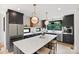 Modern kitchen with stainless steel appliances, large island with seating, and contemporary lighting at 309 Sain Rd, Statesville, NC 28625