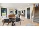 Bright living room featuring hardwood floors, large windows, and stylish contemporary furnishings at 309 Sain Rd, Statesville, NC 28625