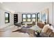 Bright and airy living room with hardwood floors, modern furnishings, and scenic outdoor views at 309 Sain Rd, Statesville, NC 28625