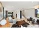 Bright and airy living room flows into kitchen, featuring modern decor and light wood floors at 309 Sain Rd, Statesville, NC 28625