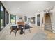 Bright living room with modern furnishings, large windows, and light wood floors at 309 Sain Rd, Statesville, NC 28625
