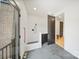 Modern mud room with dog shower, cabinets, and access to the exterior, perfect for pet owners at 309 Sain Rd, Statesville, NC 28625