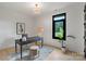 Office space with desk, decor, modern light fixture and large window at 309 Sain Rd, Statesville, NC 28625