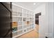 Walk-in pantry with custom shelving, providing ample storage space for kitchen essentials at 309 Sain Rd, Statesville, NC 28625