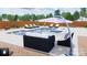 Backyard pool and spa with lounge seating, umbrella, and manicured landscaping at 309 Sain Rd, Statesville, NC 28625