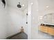 Walk-in shower with marble walls, dark hardware, and a small wooden stool adding a touch of rustic charm at 309 Sain Rd, Statesville, NC 28625