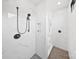 Bright white marble shower with contemporary fixtures, built-in niche, and sleek design for a modern aesthetic at 309 Sain Rd, Statesville, NC 28625