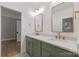 A bright bathroom features double sinks, lots of counter space, and modern fixtures at 3601 Woody Grove Ln, Charlotte, NC 28210