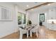 Bright dining room with unique stone table, modern chairs, and natural light at 3601 Woody Grove Ln, Charlotte, NC 28210