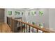 A spacious interior view with modern railing, lots of natural light, and beautiful wood floors at 3601 Woody Grove Ln, Charlotte, NC 28210